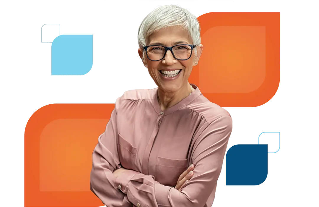 a woman wearing glasses smiles and crosses her arms