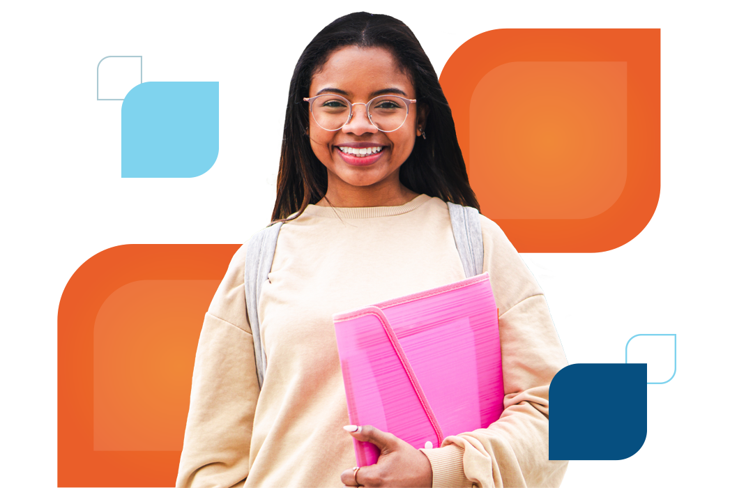 a teen girl holding a notebook smiles at the camera